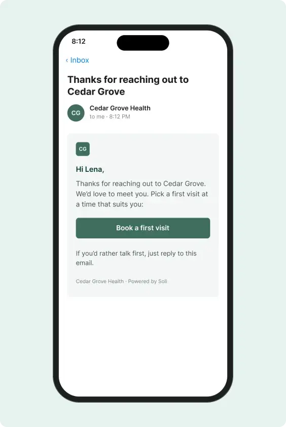 The first reply email on their phone, with a button to book a first visit