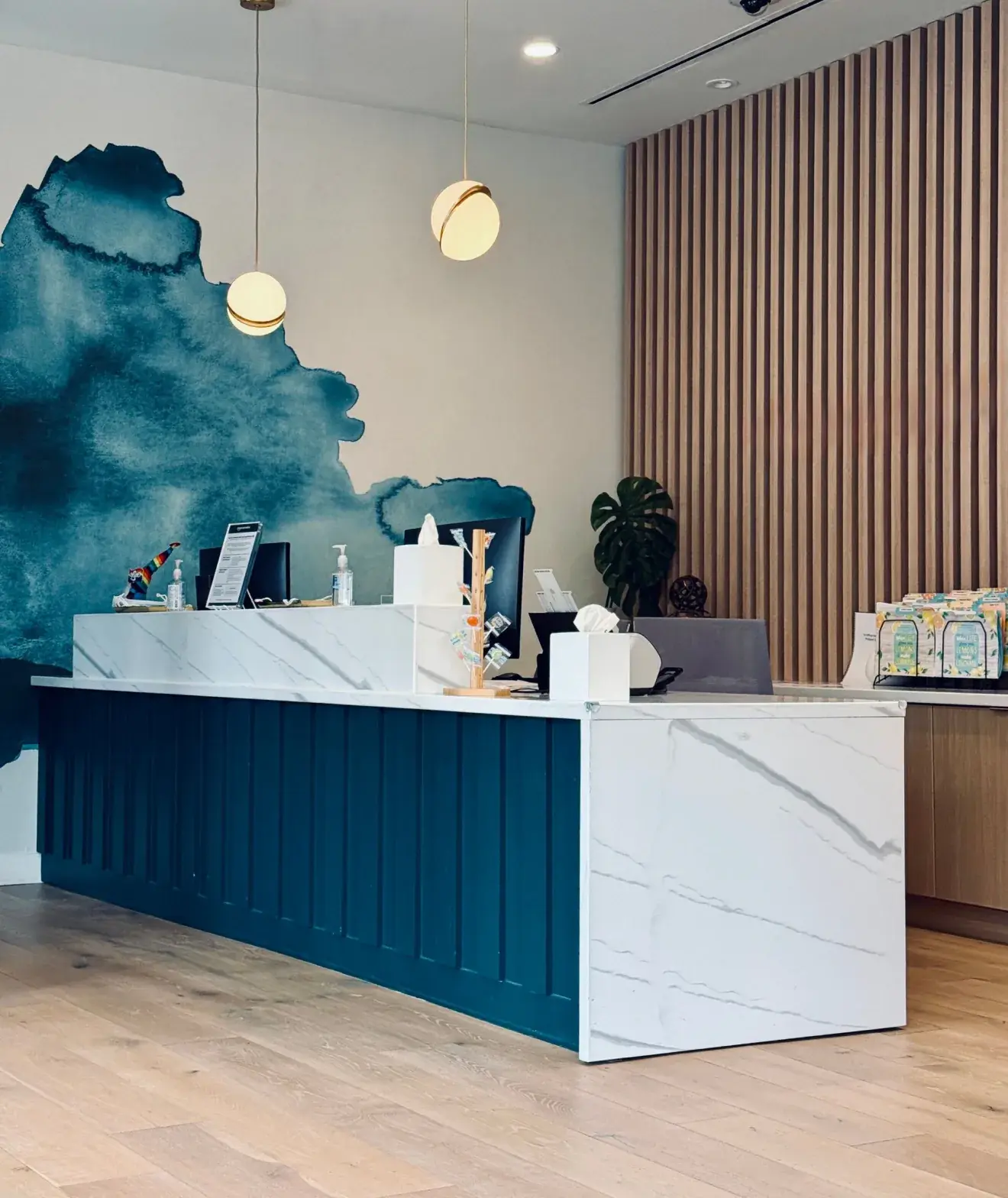 An empty front desk in a small practice waiting room