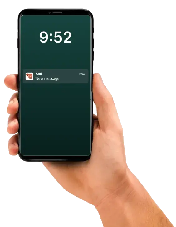 A hand holding a phone whose lock screen shows only “New message” from Soli